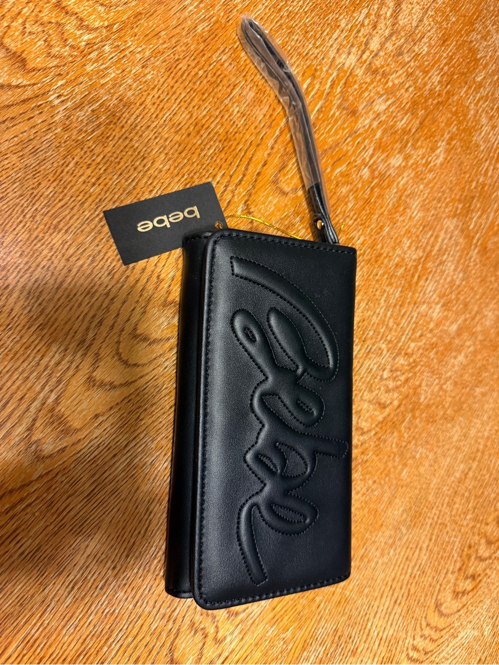 bebe Black Embossed Script Wristlet Phone Case